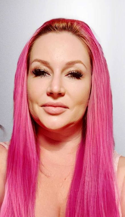 Long straight hair colored bright pink