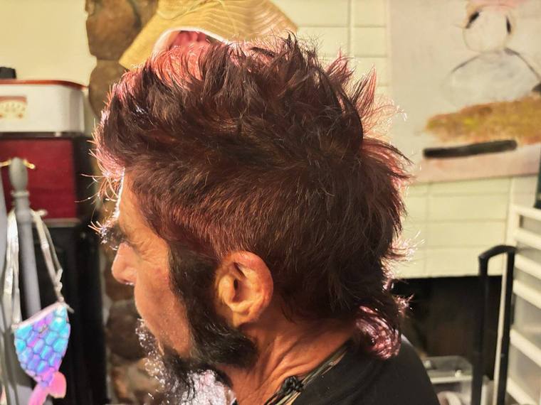 A textured mohawk with red running through it