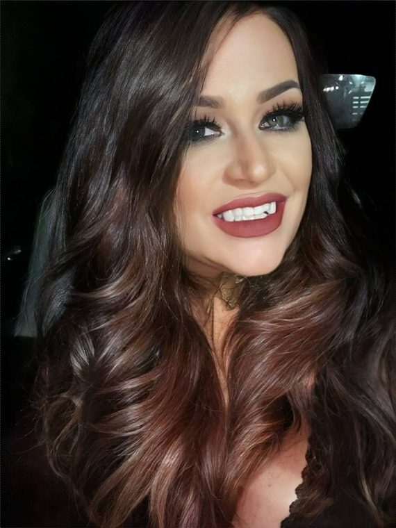 Long auburn waves with a soft curl, coloured and styled at Shear Lady Salon LLC