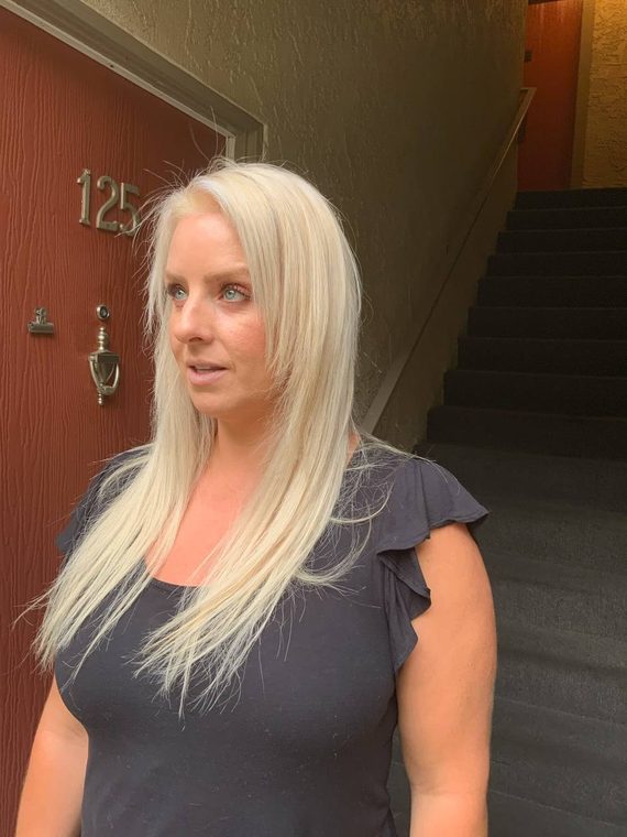Long platinum blonde hair with a smooth straight finish, coloured at Shear Lady Salon LLC