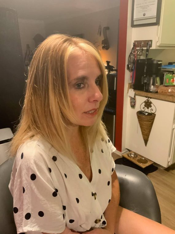 Softly layered blonde hair after a cut and colour by Christal B.