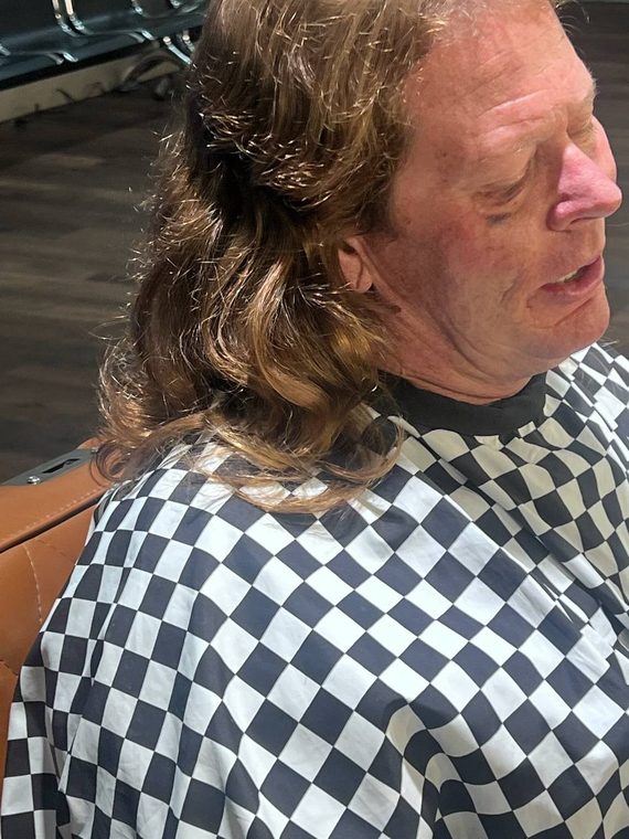 A men's mullet with layered length through the back, cut at Shear Lady Salon LLC