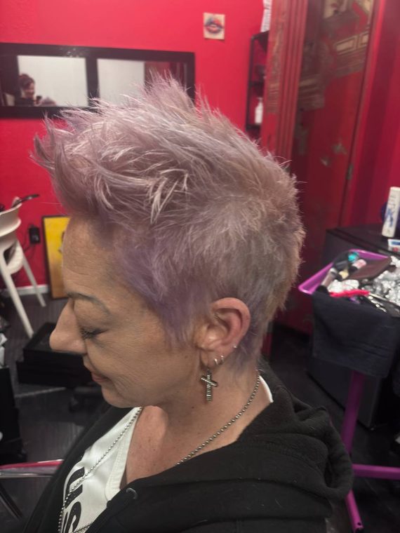 A lavender pixie with a swept fringe, coloured at Shear Lady Salon LLC