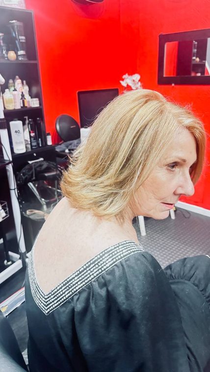 A platinum blonde bob with soft movement, coloured at Shear Lady Salon LLC