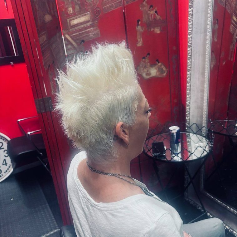 A bright platinum mohawk styled tall, cut at Shear Lady Salon LLC