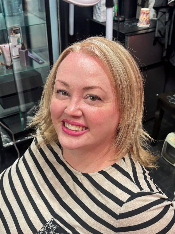 Soft blonde layers with a golden tone, coloured by Christal B.